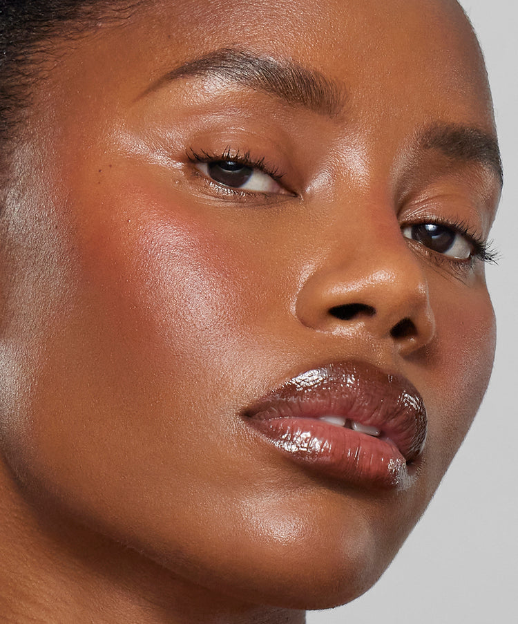Model wears Lip Sculpt & Lip Gloss in Sepia