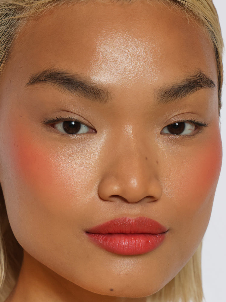 Ella wears Lip Blush in shade Papaya