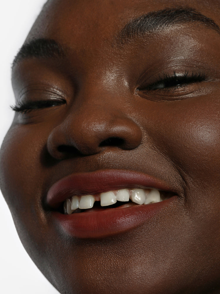 Wunmi wears Lip Blush in Canyon